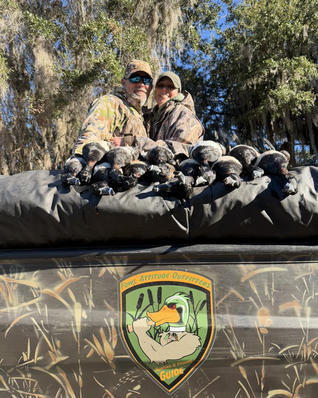 Successful duck hunting trip in Crystal River FL with numerous harvested waterfowl displayed in boat