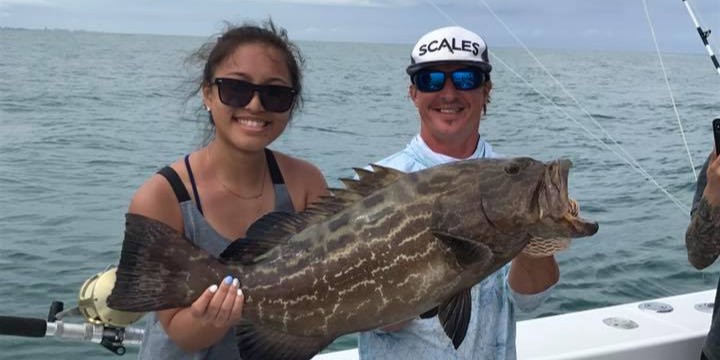 Fort Lauderdale offshore fishing boat with anglers catching fish on half day charter trip
