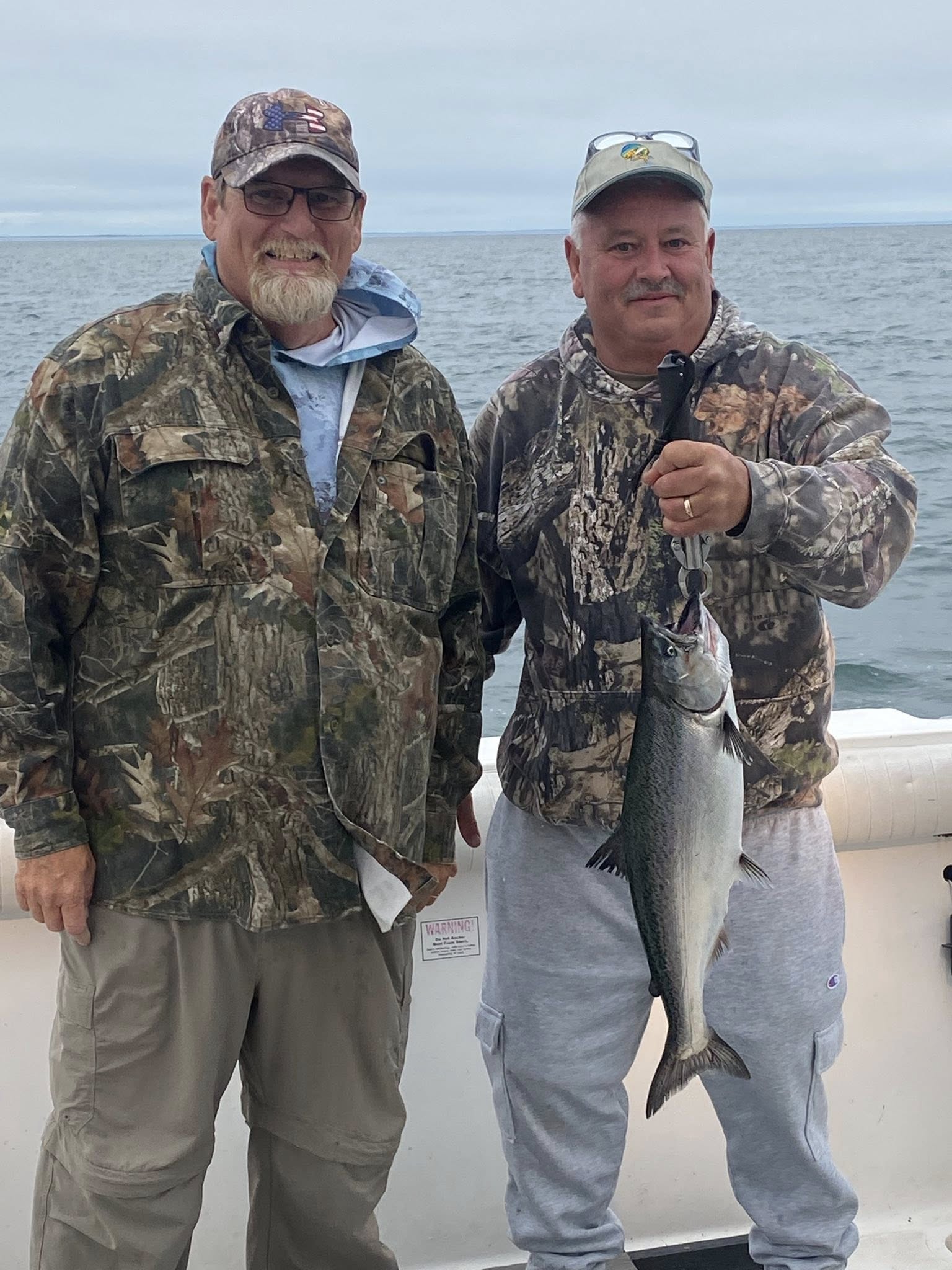 Two people fishing for Chinook Salmon in Oswego