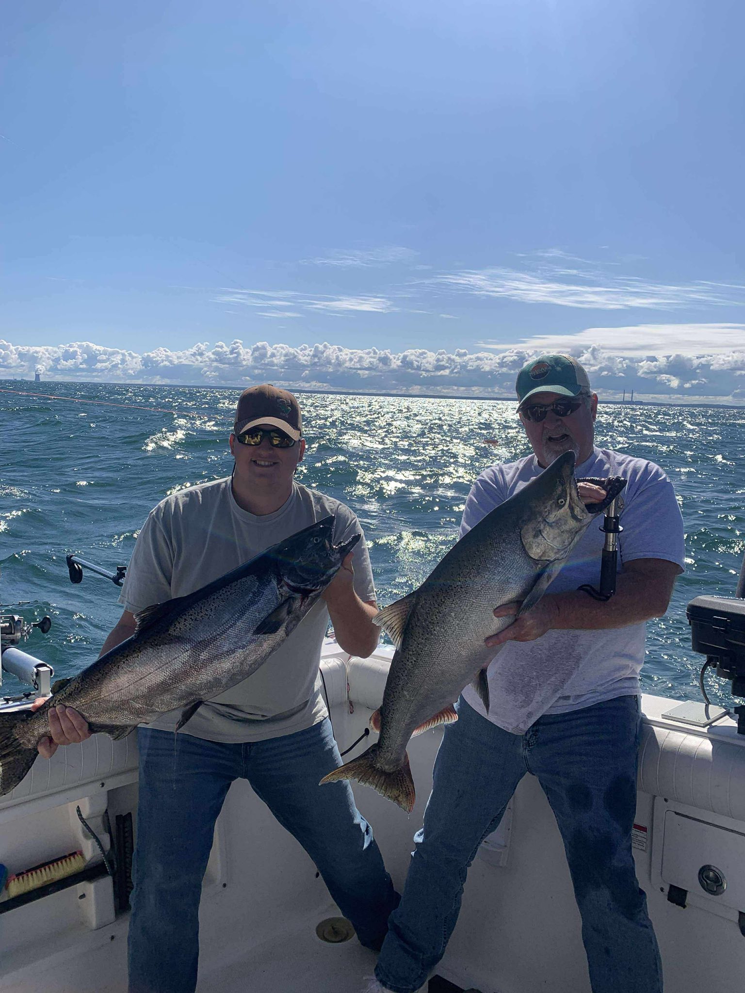 Two people fishing in Oswego