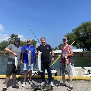 4 people fishing in ON with 2 big fish
