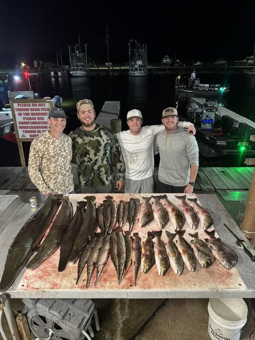 Fresh caught fish displayed on cleaning table at marina dock in Lafitte Louisiana