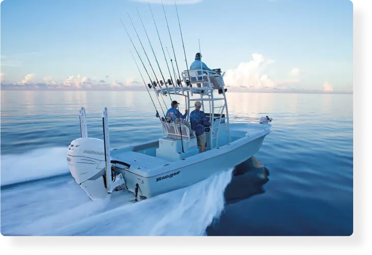 Trust Guidesly to book your fishing charter- A group of three men ride on a fishing boat in clear open waters.